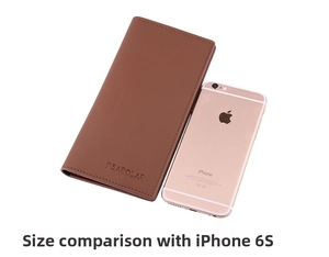 Brown leather long wallet next to a smartphone showing size comparison on a white background