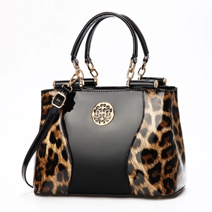 Chic women's crossbody handbag in black patent leather with leopard print and gold logo