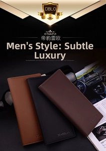 Three long men's leather wallets in brown, black and coffee colors on luxury magazine background