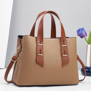 Minimalist tote bag with contrasting brown straps and litchi texture for women