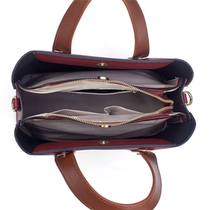 Interior view showing three compartments with center zipper and gold magnetic buckle closure