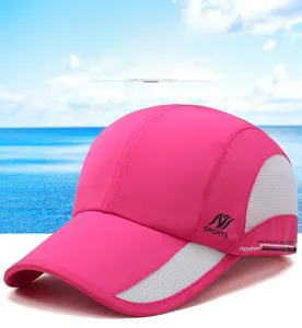 Detail of rose red quick-dry sports cap with grey breathable mesh and curved sun visor