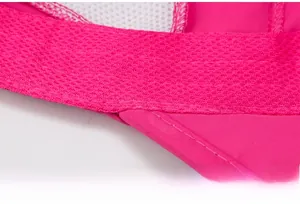 Close-up of pink quick-dry fabric and white mesh with precision stitching details