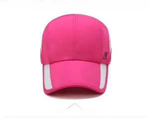 Detail of pink sports cap featuring white mesh vents and a printed side logo