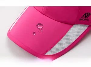 Detail of water-resistant rose pink sports cap with breathable mesh and reflective trim