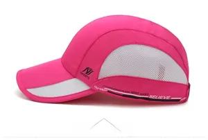 Detail of rose pink quick-dry sports hat featuring breathable side mesh and text print