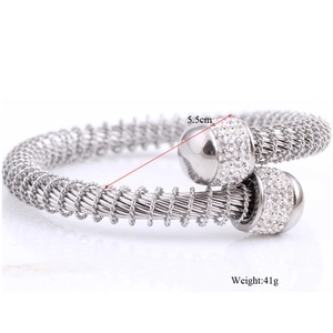 Macro view of stainless steel cable bracelet showing diamond-set ends and 5.5cm diameter