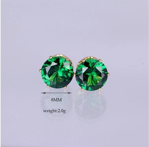 Detailed view of 8mm green zircon earrings with golden six-prong setting and mirror reflection