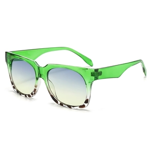 Fashionable square sunglasses with green transparent frames and leopard pattern accents