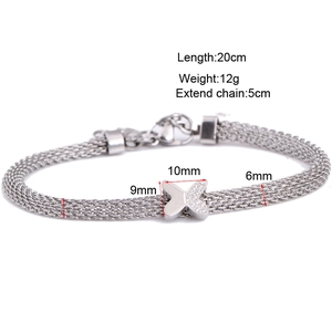 Silver mesh bracelet with a sparkling diamond-studded butterfly pendant on white background
