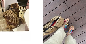 Detail of woven straw tote bag with leather handles and colorful pom-pom sandals