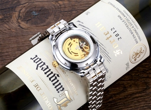 Detail of model 8082 skeleton mechanical watch showing the golden automatic movement