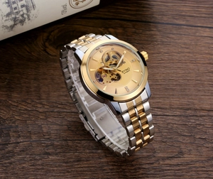 Detailed close-up of BYINO automatic mechanical watch with gold hollow skeleton dial