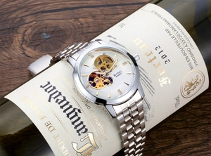 Detail of BYINO automatic mechanical watch with skeleton dial on vintage bottle