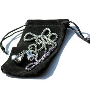 Silver boxing gloves pendant necklace with bead chain on a black velvet pouch