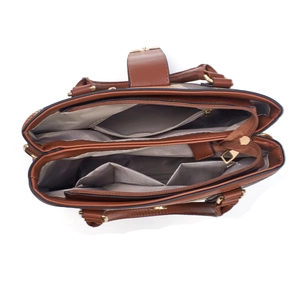 Top-down view of brown leather handbag interior with multiple compartments and gold hardware