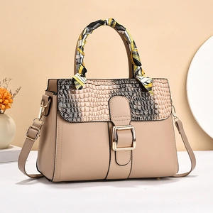 Elegant beige stone pattern handbag with scarf detail and golden buckle closure