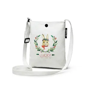White canvas crossbody bag with cute rabbit illustration and adjustable strap