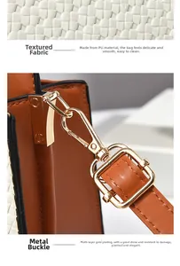 Detail view of woven white PU leather and brown textured fabric with gold metal hardware