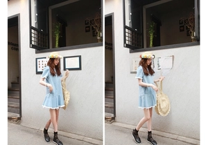 Detail of blue denim dress with white tassel hem and hollow straw bag in outdoor setting