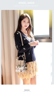 Close-up of khaki crossbody phone bag with bear print and cute plush charm pendant