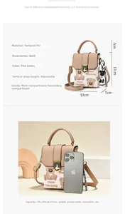 Size comparison of beige crossbody bag with cartoon bear print and adjustable strap