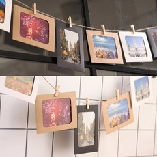 Hanging paper photo frame set with wooden clips and jute rope in kraft black and white