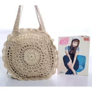 Handmade beige straw woven shoulder bag with floral hollow patterns and soft inner lining