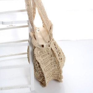 Handmade woven paper rope beach bag with floral ruffles and zipper in cream beige