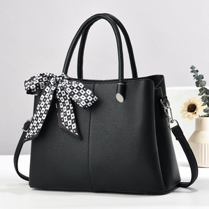 Black lychee leather tote bag with silk scarf decoration and adjustable shoulder strap