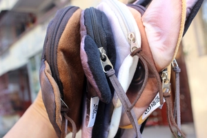 Detail of Bull Terrier print coin purses with metal zippers and fabric labels