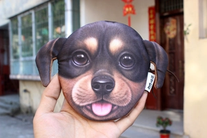 Close-up of a round Rottweiler puppy printed coin purse held in hand with zipper