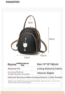 Detailed view of black PU leather mini backpack with golden cat pendant and tassel