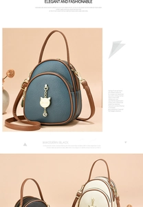 Detail of mini multi-layer backpacks in lychee grain leather with golden cat pendants