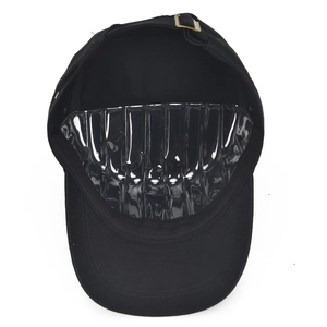 Interior view of black cotton cadet cap showing adjustable metal buckle and inner structure