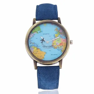 Close-up of vintage bronze watch dial with map print and unique airplane second hand