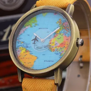Detail of quartz watch featuring bronze case, world map dial and denim strap