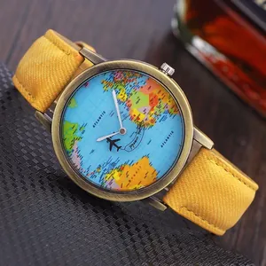Detailed close-up of vintage quartz watch with world map dial and yellow canvas strap