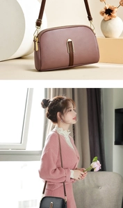 Close-up of soft leather mini crossbody bag with litchi texture and gold hardware detail