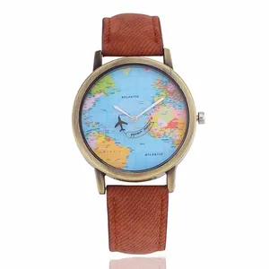 Close-up of world map watch dial with airplane second hand and vintage bronze case