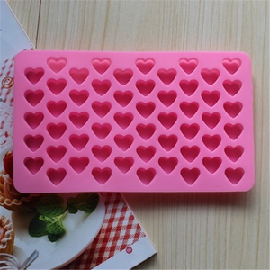 Detail of pink silicone mold with 55 mini heart cavities for DIY chocolate and candy