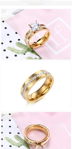 Detail of gold titanium steel wedding ring set featuring large round cut zircon stone