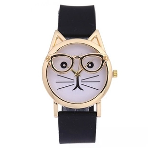 Detailed close-up of a golden cat-ear shaped watch case with playful cat face dial design