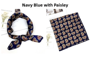 Detail of navy blue square scarf featuring classic paisley patterns for neck styling
