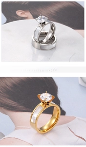 Detailed close-up of titanium steel couple rings with shell inlay and round zirconia