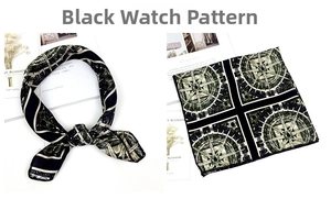 Detail view of a black silk scarf featuring vintage clock and compass print patterns