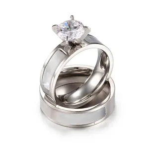 Polished titanium steel couple ring set with round cut zircon and pearl shell inlay