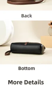 Detail view of the black lychee pattern leather bag showing the back and bottom structure
