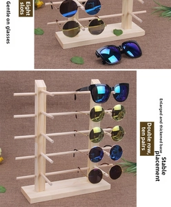 Detail of wooden eyewear display stands showing double row and 8-pair storage capacity