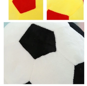 Close-up of stitching details and soft texture on plush soccer ball in multi-color options